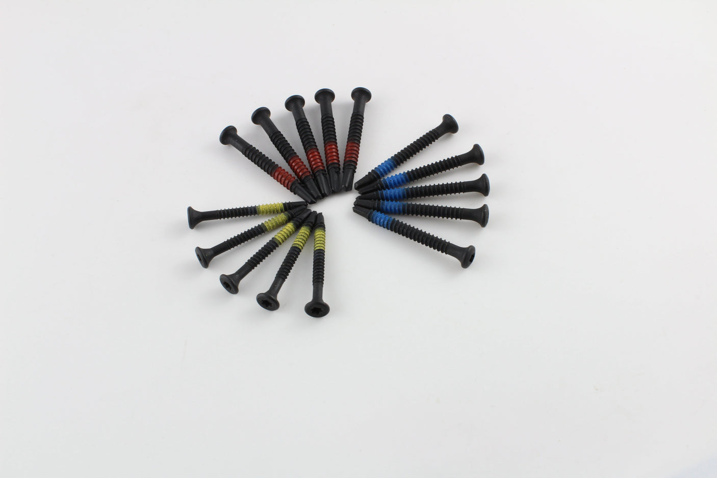 Lokko extraction screws in a circular spread with red, blue, and yellow bands and Torx-style heads