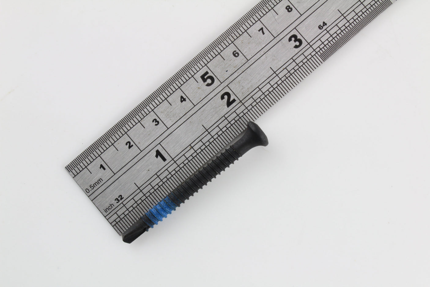 Studio arrangement of Lokko extraction screws with red, blue, and yellow thread markings