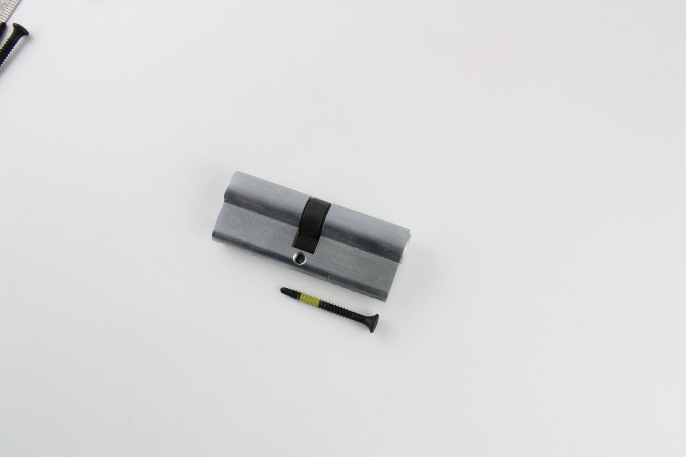 Lokko extraction screws laid out together, sorted by red, blue, and yellow diameters