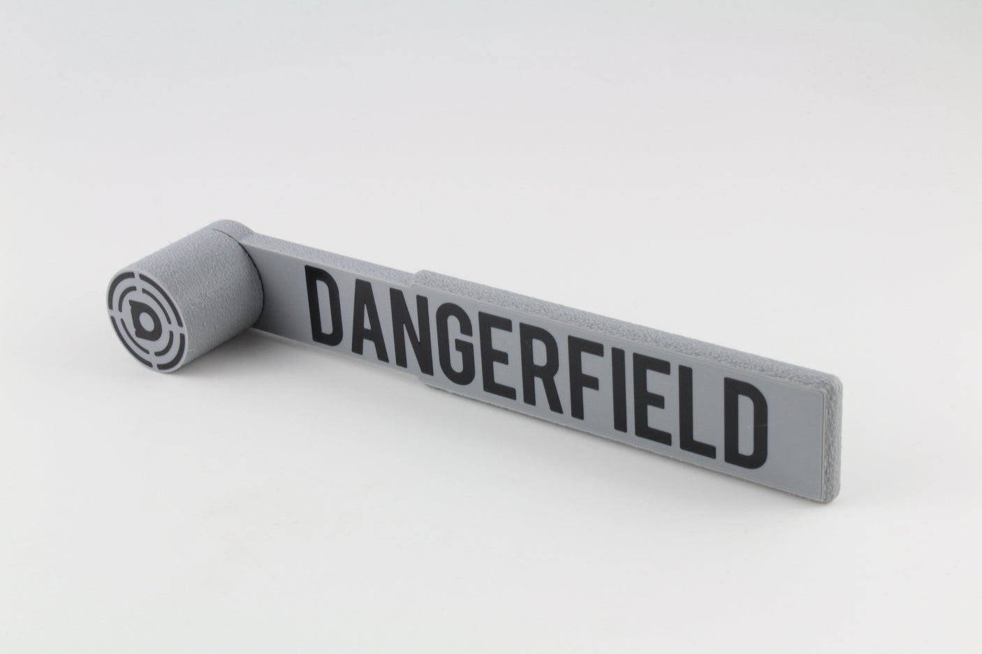 Dangerfield Bump Hammer angled view showing the round striking head and flat branded handle