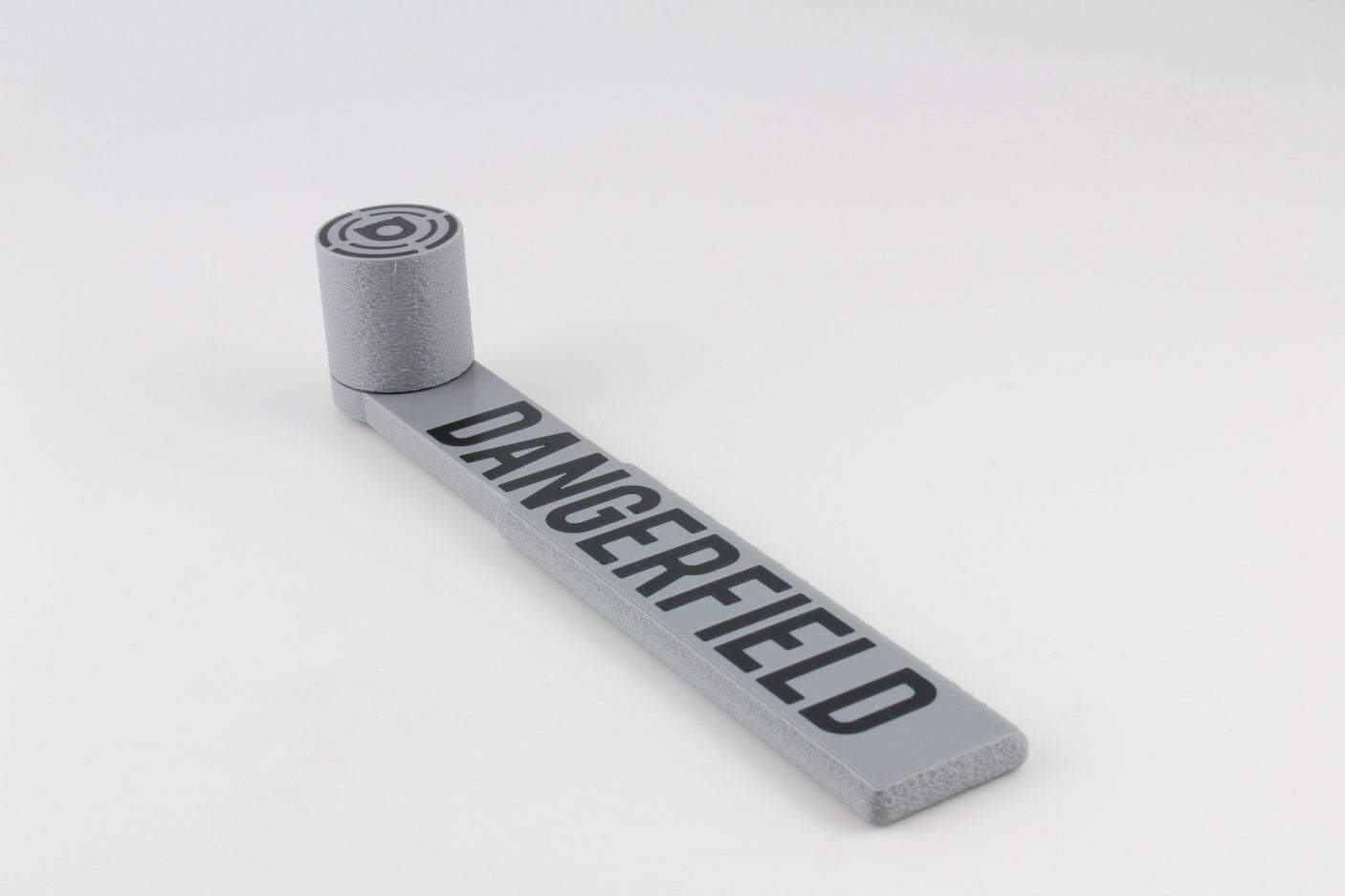 Full side view of the Dangerfield Bump Hammer laid flat, showing the handle and striking head