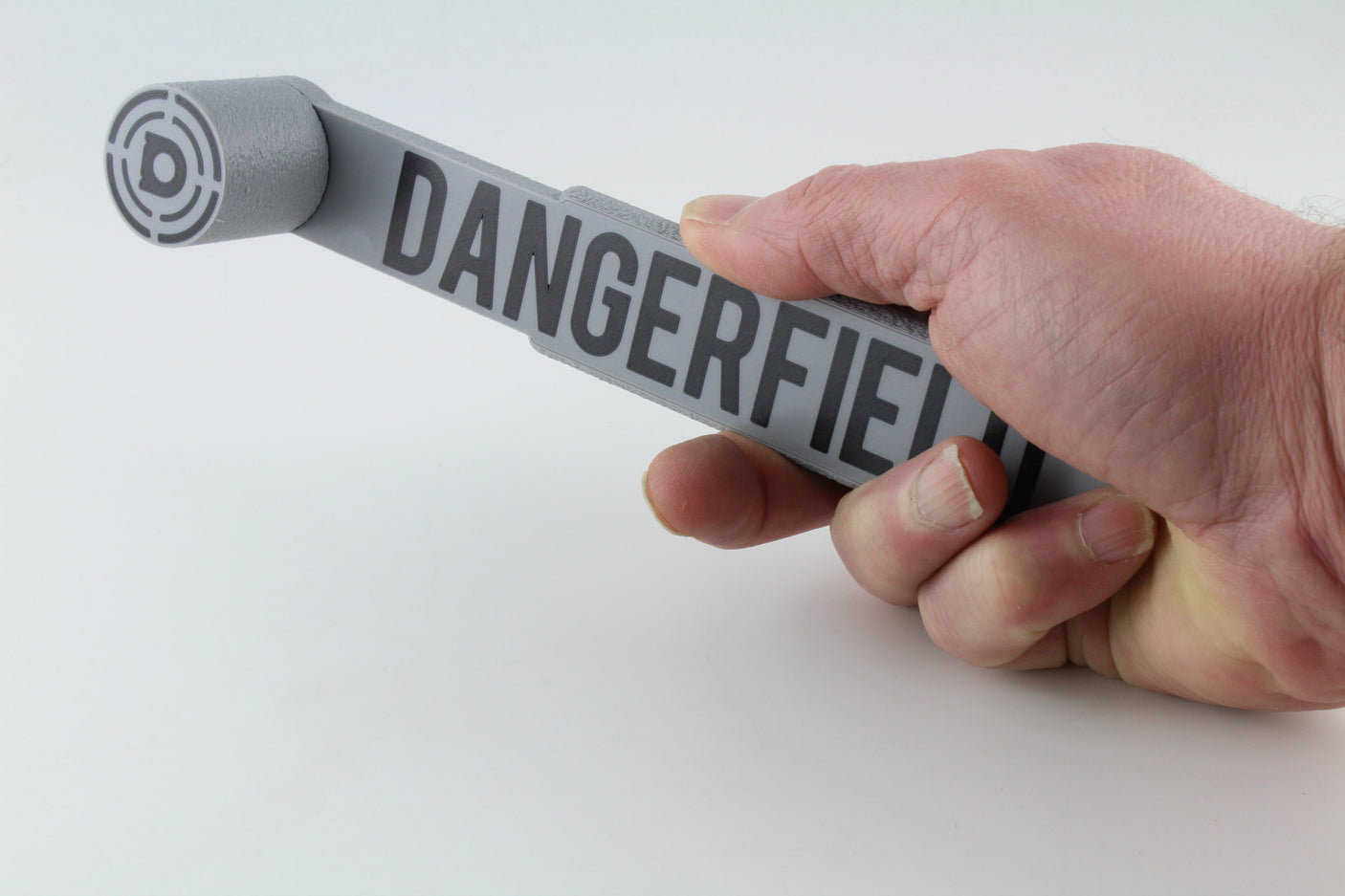 Dangerfield Bump Hammer held in hand showing the flat grip and compact head