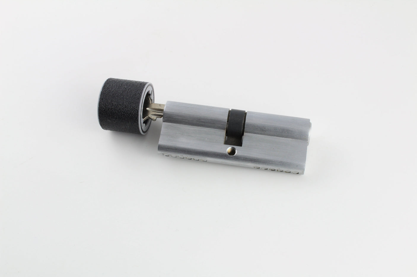 Bump key fitted with the rubber dampener inserted into a euro profile cylinder lock, ready to be struck