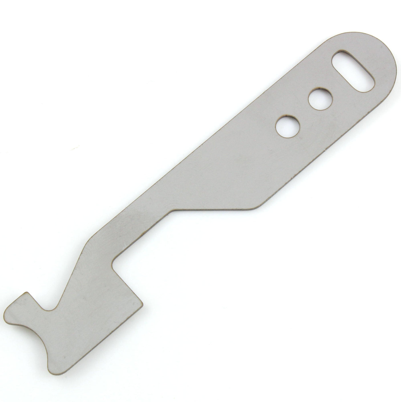 Close view of the Lokko shove-knife working end showing the stepped hooked tip cut into flat stainless steel