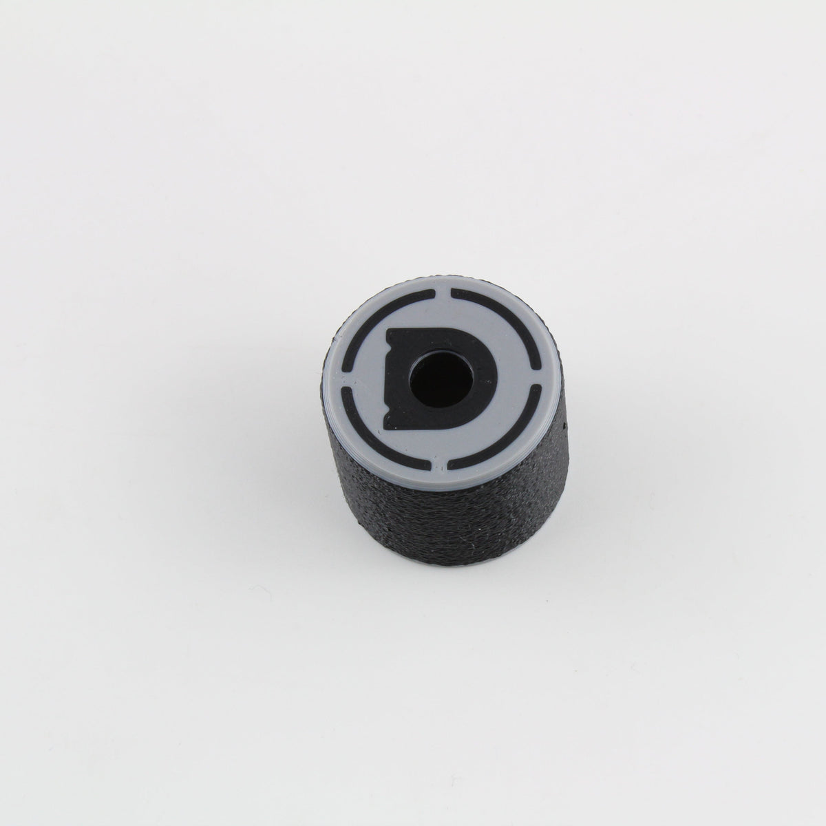 Top view of the bump key dampener showing the grey cap, central keyway slot and Dangerfield D logo