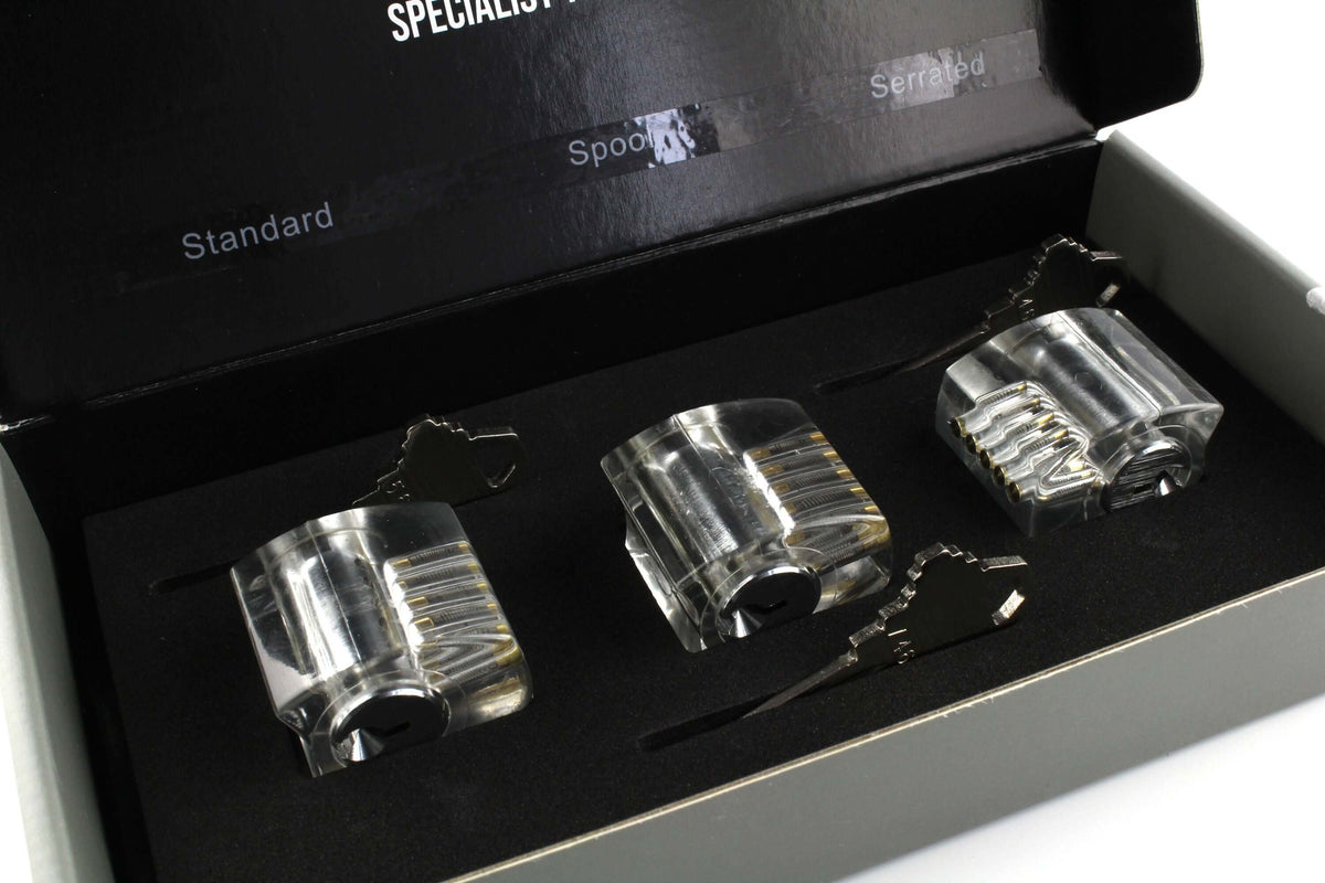 The Dangerfield Eureka practice lock set open in its box, with clear standard, spool and serrated pin locks and their keys