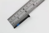 Single blue-banded Lokko plug puller screw measured against a steel ruler at about four centimetres