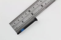 Single blue-banded Lokko plug puller screw measured against a steel ruler at about four centimetres
