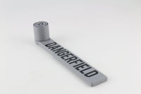 Full side view of the Dangerfield Bump Hammer laid flat, showing the handle and striking head