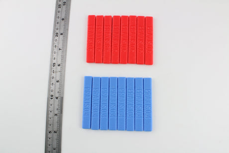 Dangerfield Praxis grip handles beside a steel ruler, red 0.6 and blue 0.4 handles shown for scale