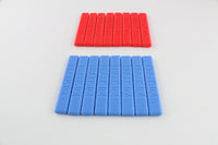 Two rows of Dangerfield Praxis grip handles, red 0.6 handles above blue 0.4 handles on a white surface
