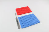 A bare Dangerfield Praxis lock pick laid beside a row of blue Praxis grip handles, showing how a bare blade pairs with a handle