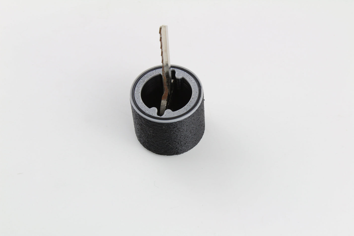 Bump key and rubber dampener positioned at the face of a lock cylinder