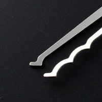 Single peak and triple peak bogota lock picks on a black background