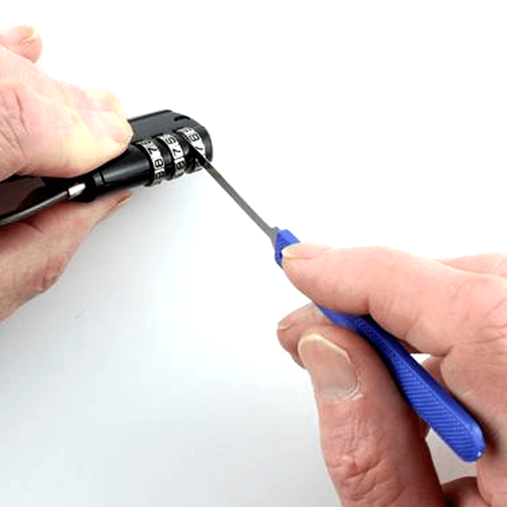 Person decoding a combination lock with a miniknife tool on a white background