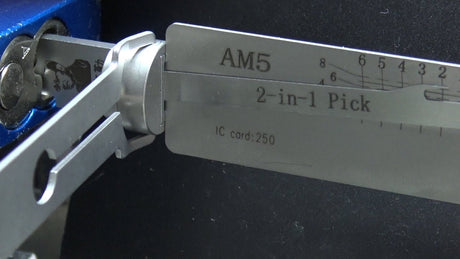 Lishi AM5 pick engaged with an American Lock padlock cylinder