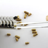 Dangerfield tweezers placing a pin into a lock cylinder during repinning