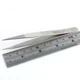 Side view of Dangerfield repinning tweezers next to a ruler for scale