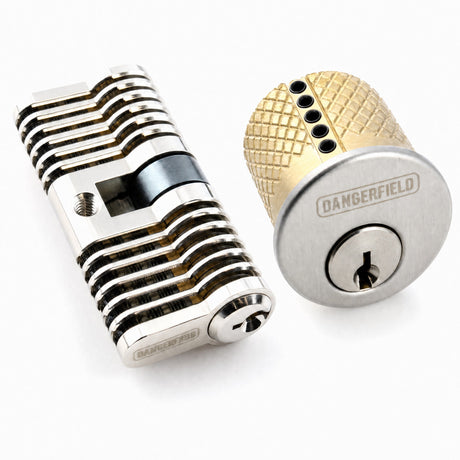 Dangerfield aluminum cutaway repinnable lock and repinnable mortise practice lock side by side