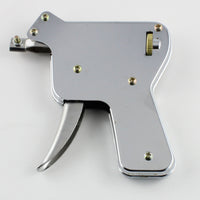 Lokko manual pick gun in hand with the trigger and needle holder ready to snap