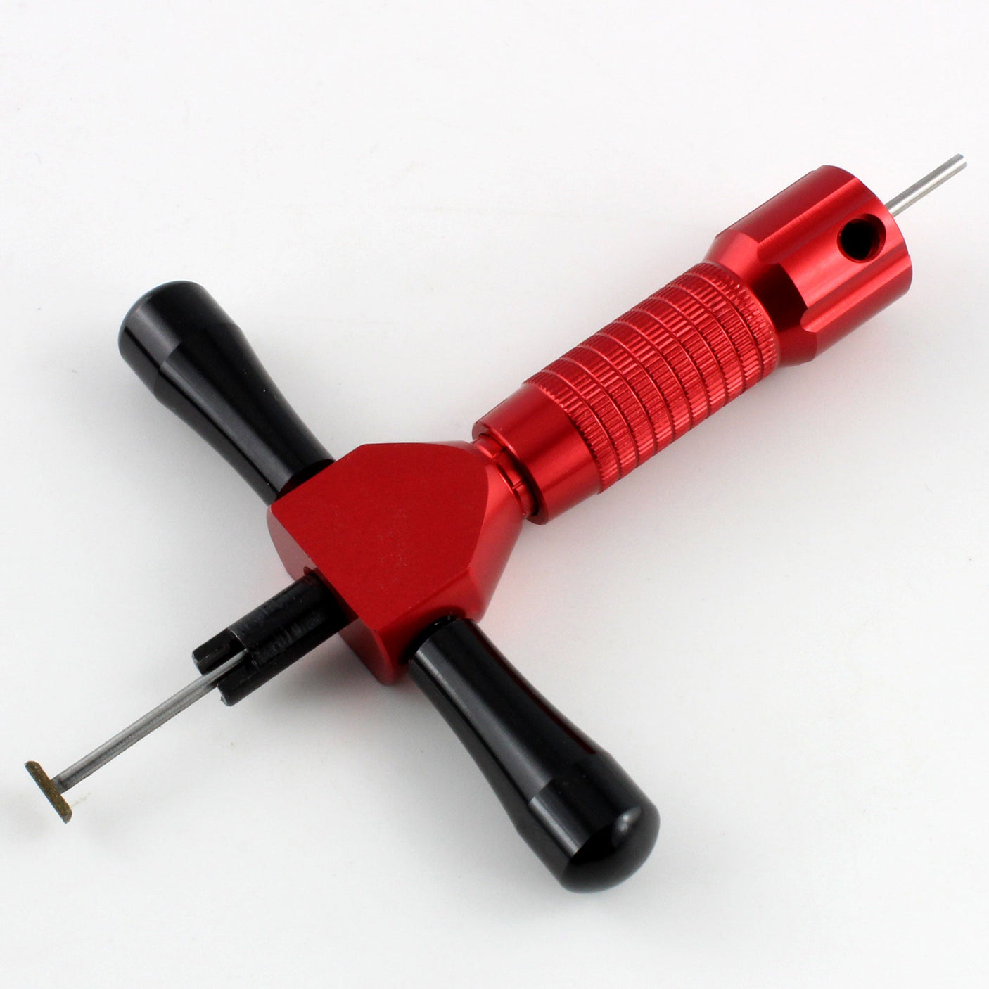 Angled view of the Lokko disc detainer lock pick showing the working tip and red grip handle