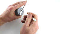 Close view of a euro cylinder held in the Lokko hand support while being picked, keyway and tension tool in frame