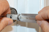 Lishi KW1 decoder grid close-up while picking a residential lock