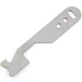 Close view of the Lokko shove-knife working end showing the stepped hooked tip cut into flat stainless steel