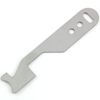 Close view of the Lokko shove-knife working end showing the stepped hooked tip cut into flat stainless steel