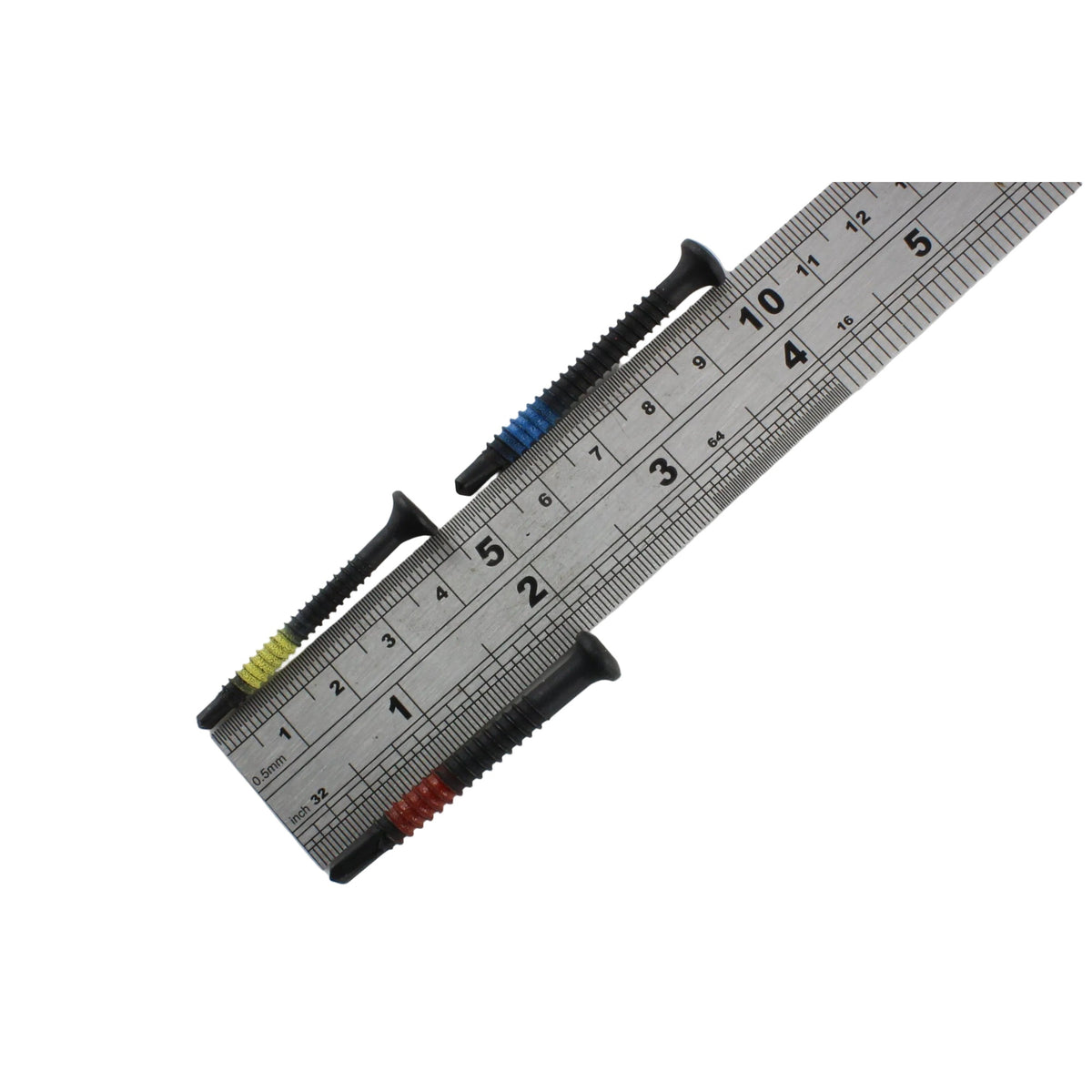Three Lokko plug puller screws laid across a steel ruler, each around four to five centimetres long
