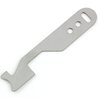 Close view of the Lokko shove-knife working end showing the stepped hooked tip cut into flat stainless steel