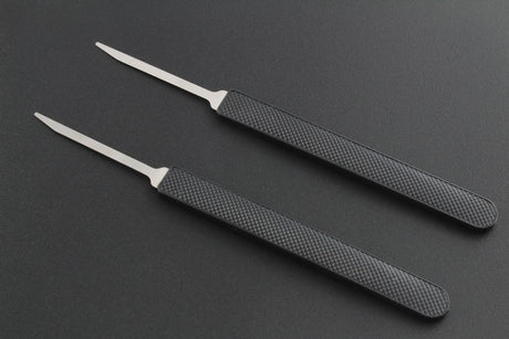 two miniknives - a lock picking tool with a handle and a thin prove-like blade at one end